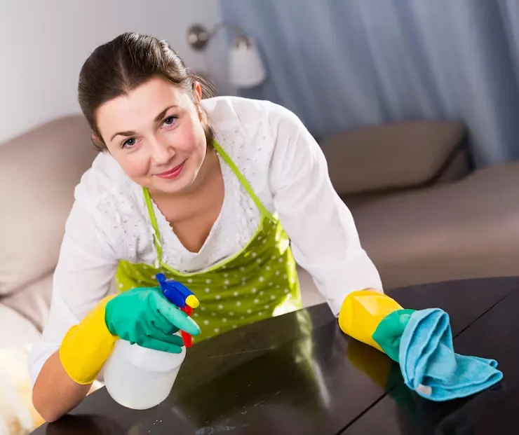 Move-out cleaning in Burnaby: professional cleaner with supplies in an empty, bright home